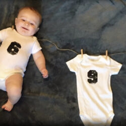 A baby in a onesie for patient story on conceiving with PCOS | Dallas IVF | Frisco, TX