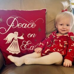 Happy blonde baby Ainsley in red highlights IUI and successful conception after endometriosis treatment | Dallas IVF