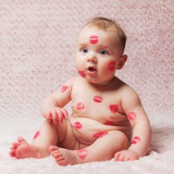 Dallas IVF baby covered in red lipstick kisses 